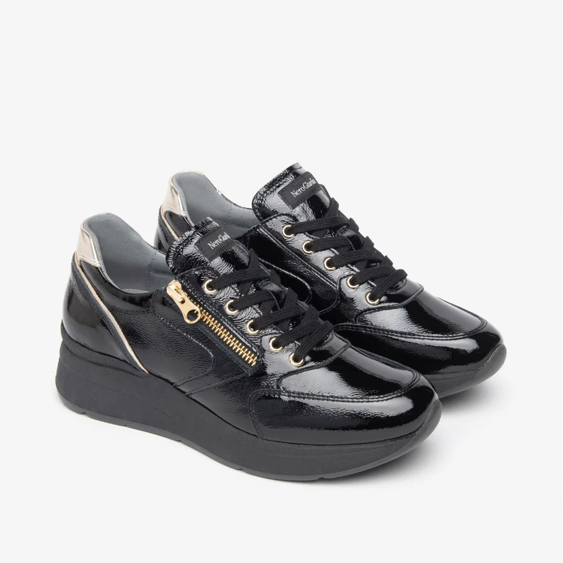 Sneaker da donna NeroGiardini in vernice nera con zip laterale
